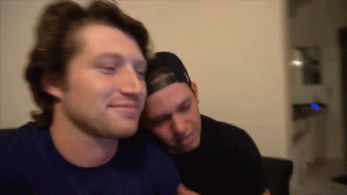 Two Men Sitting On Couch GIF