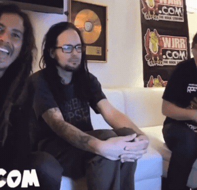 Two Men Sitting On Couch In Front Of WJBR.com Poster GIF