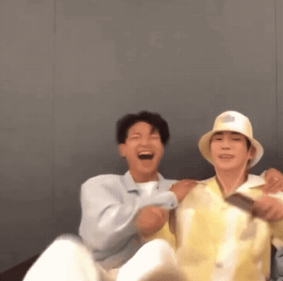 Two Men Sitting On Couch Laughing GIF