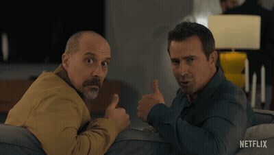 Two Men Sitting On Couch One Thumbs Up GIF