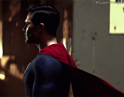 Two Men Sitting On Stage In Dark Room GIF
