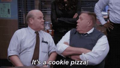 Two Men Sitting Saying It's A Cookie Pizza GIF