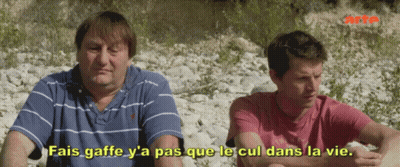Two Men Sitting With Fais Gaffe Y'a Pas Que Le Cul Dans La Vie GIF