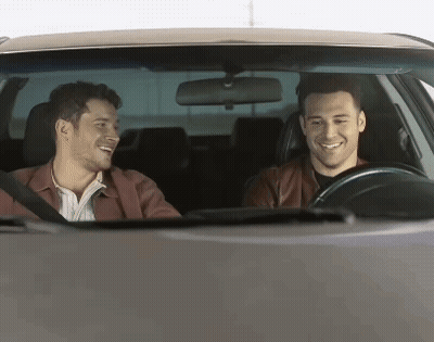 Two Men Smiling And Laughing In Car GIF