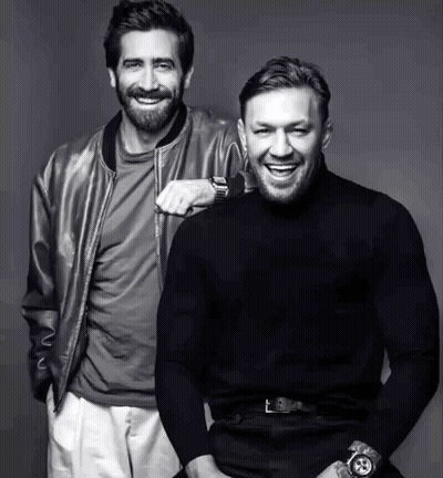 Two Men Smiling Side By Side GIF