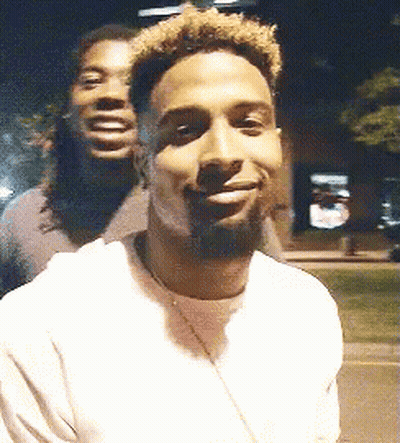 Two Men Smiling Together GIF