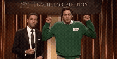 Two Men Stand In Front Of A Bachelor Auction Sign GIF