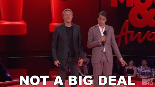 Two Men Stand On A Stage With The Words " Not A Big Deal " Behind Them GIF