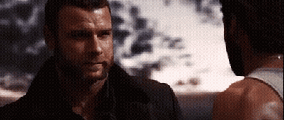 Two Men Standing And Looking At Each Other GIF