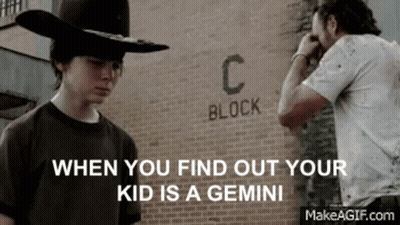 Two Men Standing Before Brick Wall Saying Block C GIF