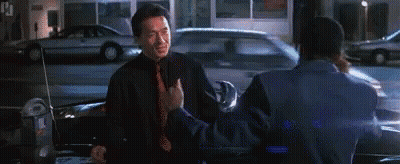 Two Men Standing Beside Car On Street GIF