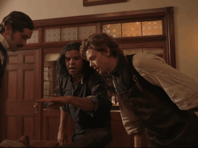 Two Men Standing By Door GIF