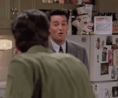 Two Men Standing By Refrigerator GIF