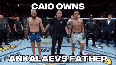 Two Men Standing In A Boxing Ring With The Caption Caio Owns GIF