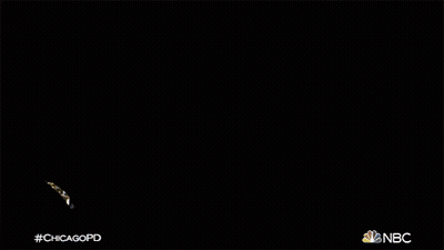 Two Men Standing In Back Of Car With NBC Logo GIF