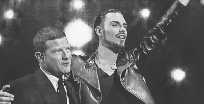 Two Men Standing In Black And White Photo GIF
