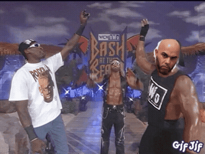 Two Men Standing In Crowd GIF