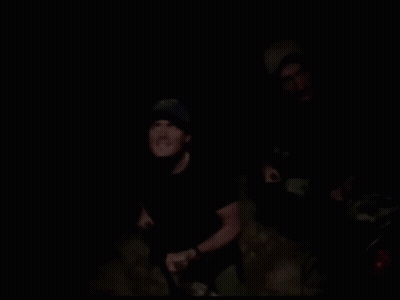 Two Men Standing In Dark Saying Damn GIF