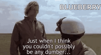 Two Men Standing In Field Talking GIF
