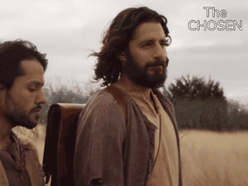 Two Men Standing In Field With The Chosen GIF