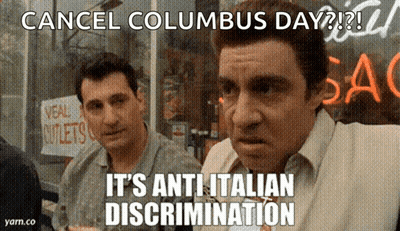 Two Men Standing In Front Of A Store That Says " Cancel Columbus Day " On It GIF