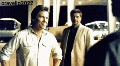 Two Men Standing In Front Of Building Cravello2022 GIF