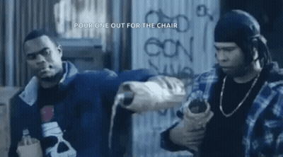 Two Men Standing In Front Of Graffiti Wall GIF
