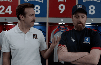 Two Men Standing In Front Of Lockers 24 And 9 GIF