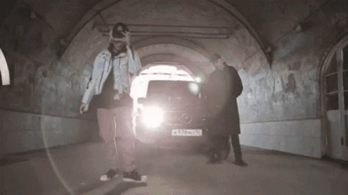 Two Men Standing in Front of Mercedes