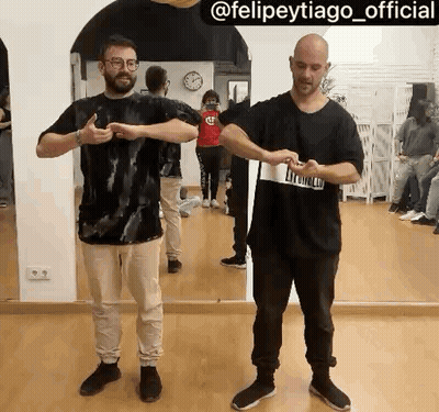 Two Men Standing In Front Of Mirror GIF
