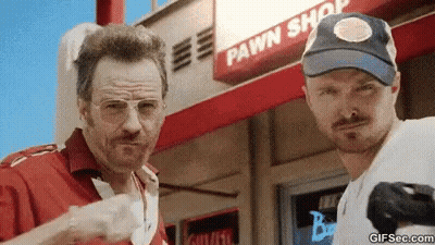 Two Men Standing In Front Of Pawn Shop GIF