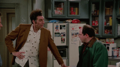 Two Men Standing In Front Of Refrigerator With Duck Donuts Sticker GIF