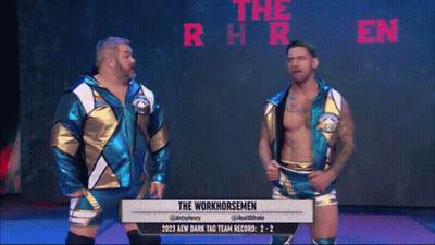 Two Men Standing In Front Of Screen Saying The Workhorsemen GIF