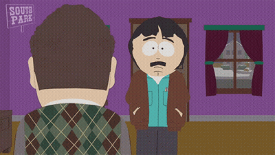 Two Men Standing In Front Of South Park Sign GIF