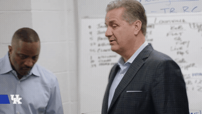 Two Men Standing In Front Of Whiteboard With UK Logo GIF