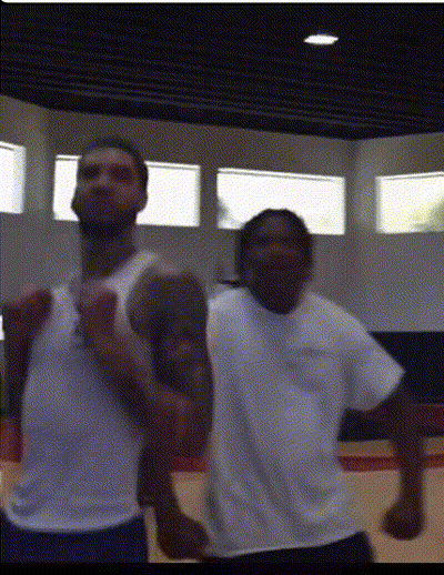 Two Men Standing In Gym GIF