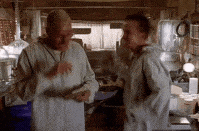 Two Men Standing In Kitchen Talking GIF