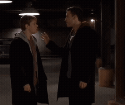 Two Men Standing In Parking Garage GIF