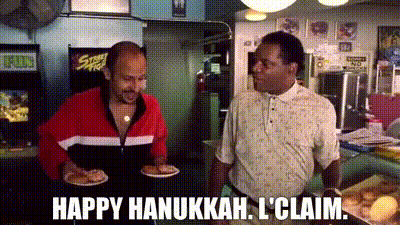 Two Men Standing In Restaurant Saying Happy Hanukkah I Claim GIF