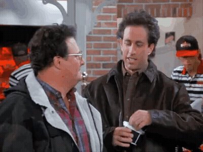 Two Men Standing In Restaurant Talking GIF