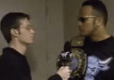 Two Men Standing In Room One Wearing Sunglasses GIF
