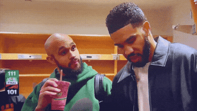 Two Men Standing In Room With Sign 111 GIF