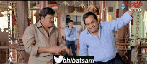 Two Men Standing In Room With Twitter Logo GIF