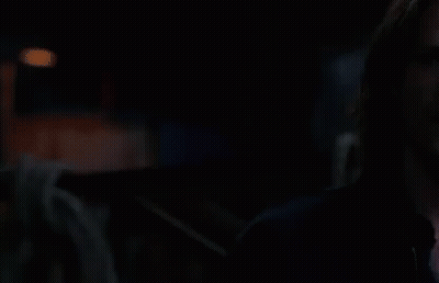 Two Men Standing In The Dark GIF