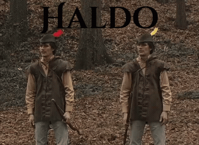 Two Men Standing In Woods With Waldo GIF