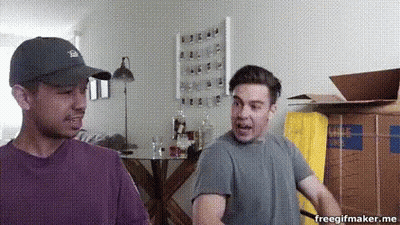 Two Men Standing Next To Boxes GIF