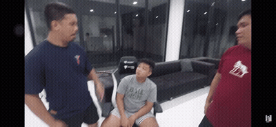 Two Men Standing Next To Boy In DMZ Crew Shirt GIF