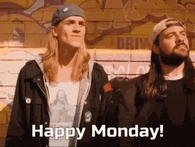 Two Men Standing Next To Brick Wall GIF