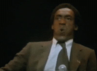 Two Men Standing Next To Car In Front Of Cosmo Store GIF