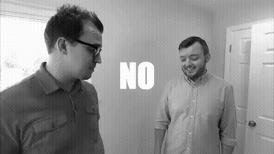 Two Men Standing Next To Each Other GIF